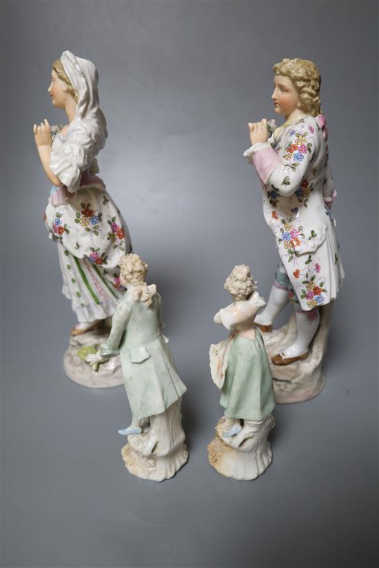 Two pairs of Continental porcelain figures of a man and woman, 15cm and 26cm